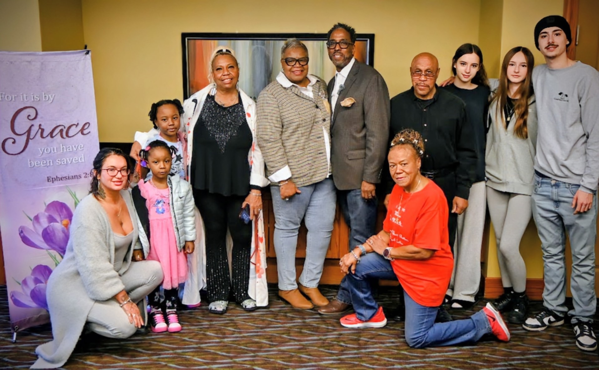 The His Grace Is Sufficient Ministries church family gathered together after a Sunday service